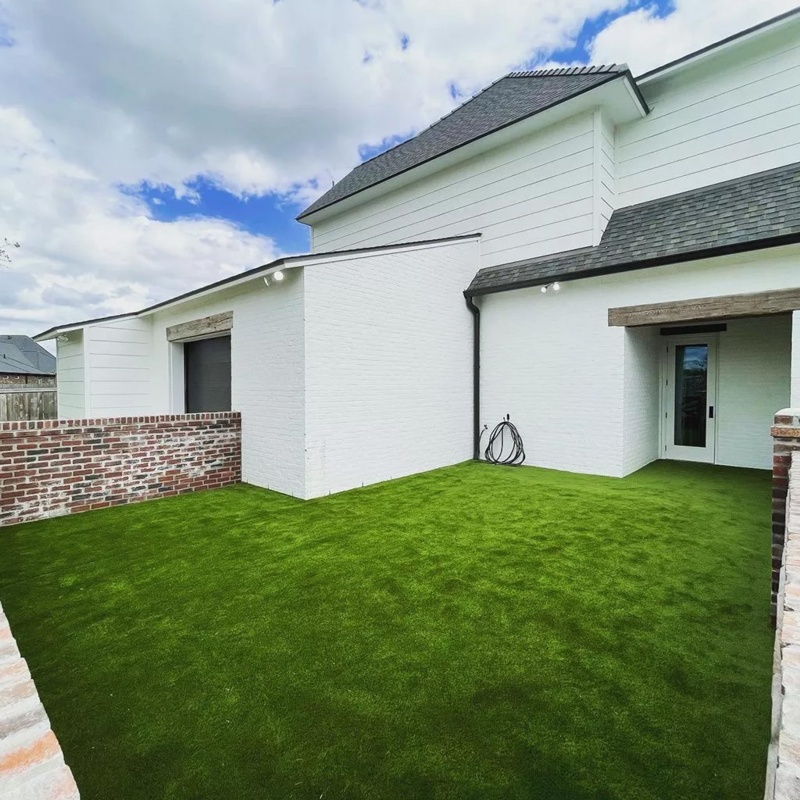 Small backyard made of artificial grass